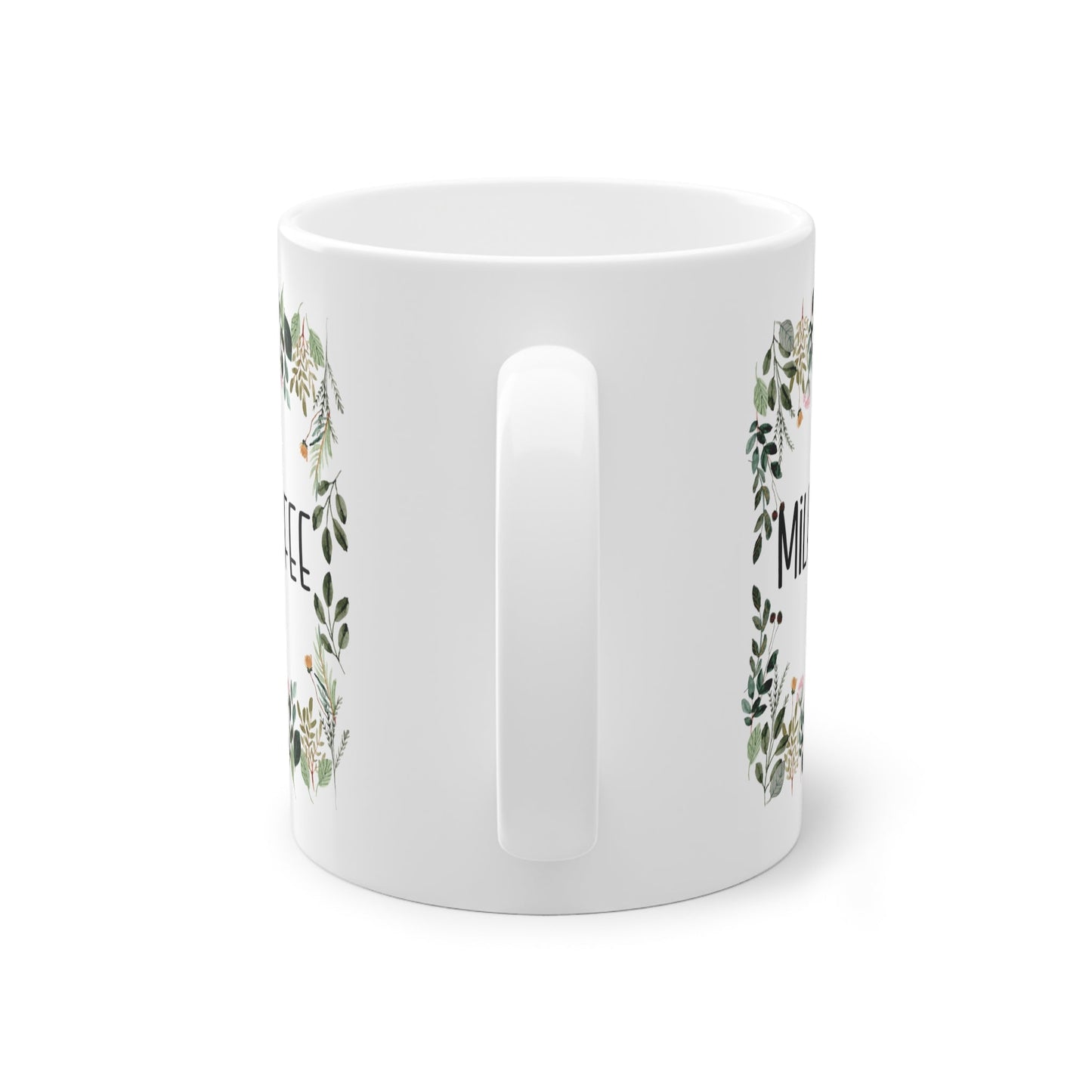a white mug with a floral design on it