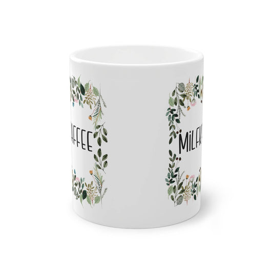 a white coffee mug with a floral design