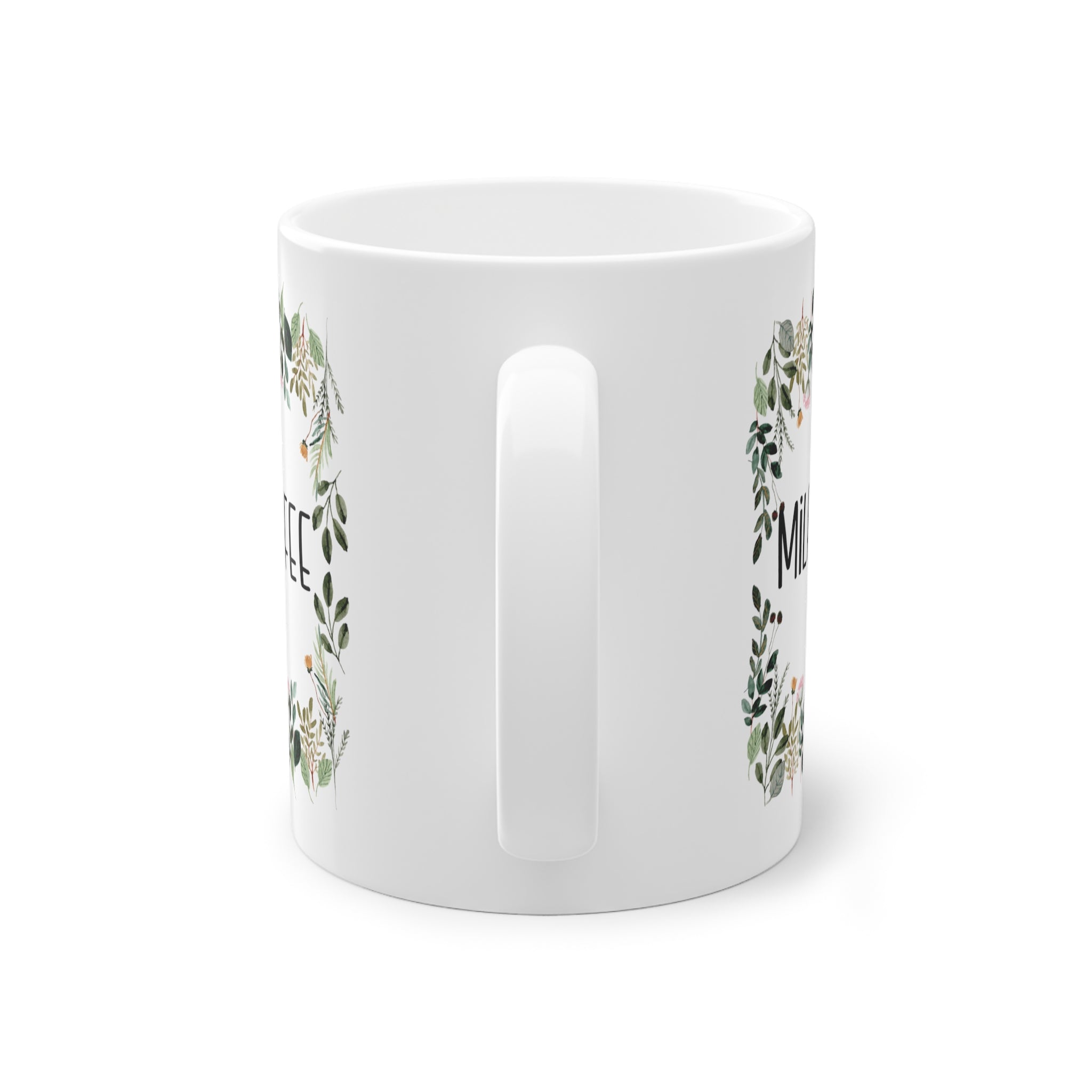 a white mug with a floral design on it