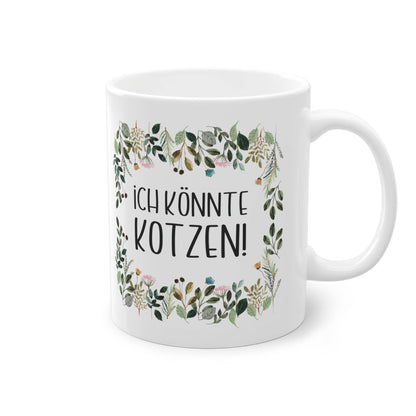 a white coffee mug with a floral frame on it