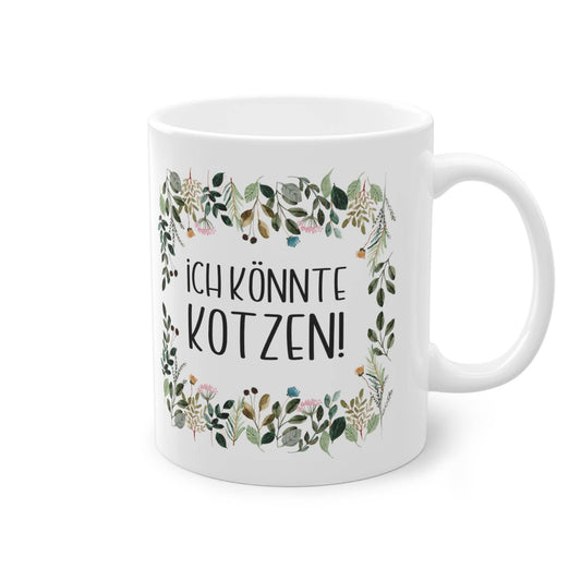a white coffee mug with a floral frame on it