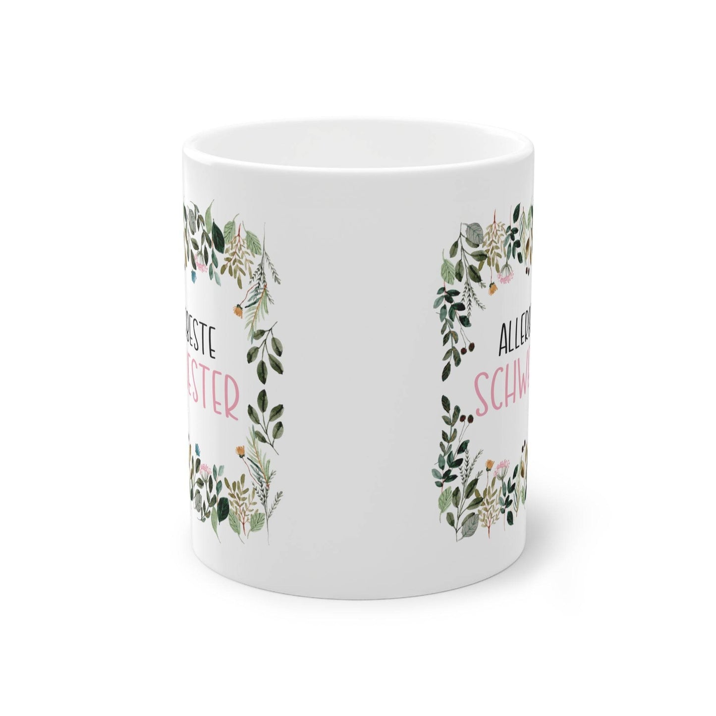 a white coffee mug with a wreath on it
