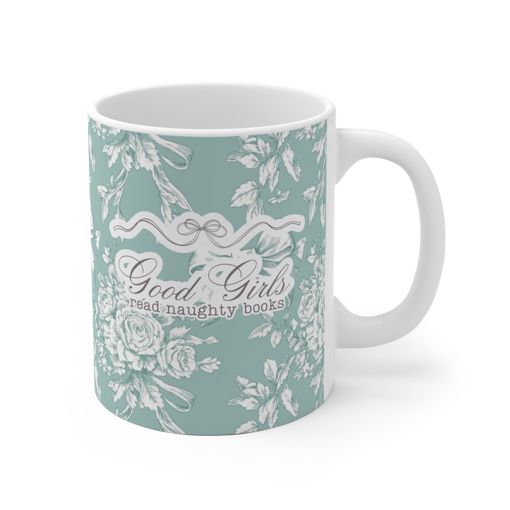 Mintfarbene Tasse mit romantischem Blumenmuster und dem frechen Spruch „Good Girls read naughty books“ – humorvolle Geschenkidee für Leserinnen von spicy Büchern und Fantasy Romance.