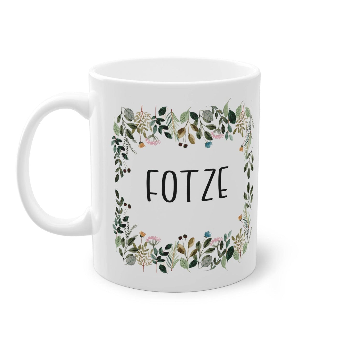 a white coffee mug with a floral frame on it