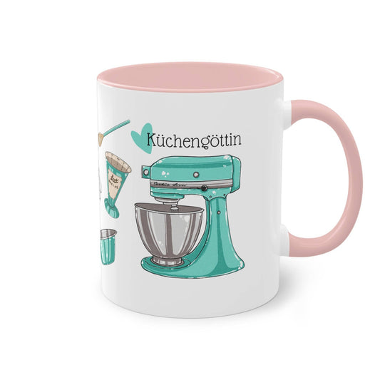 a pink and white coffee mug with a blue mixer on it
