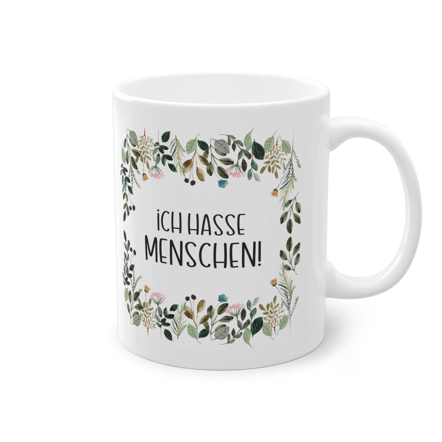 a white coffee mug with a floral frame on it