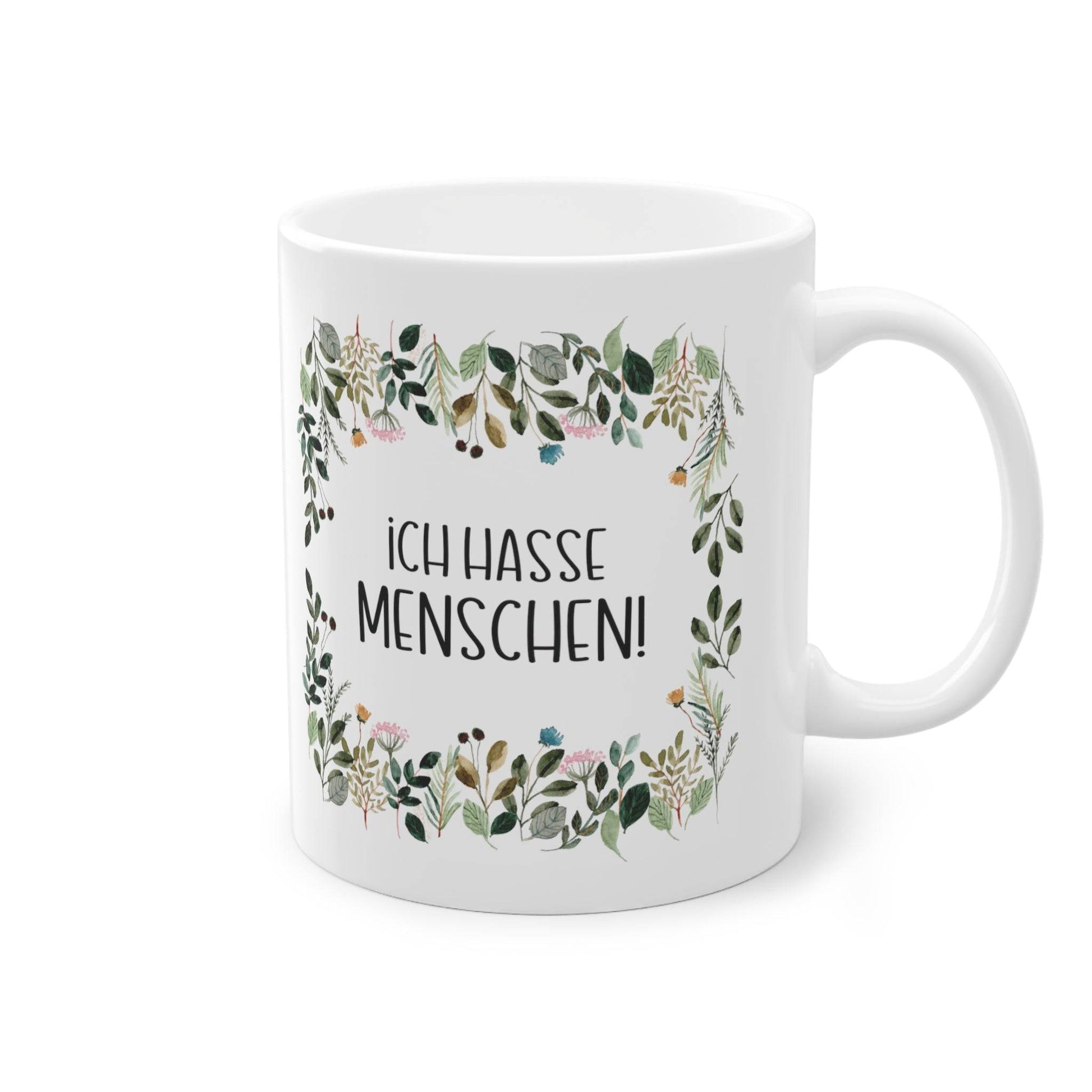 a white coffee mug with a floral frame on it