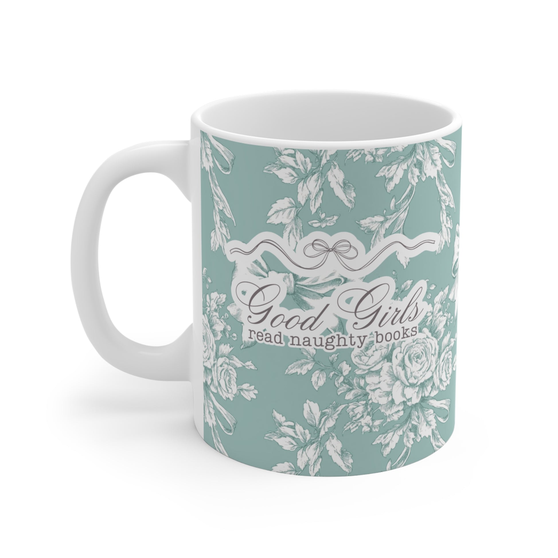 Mintfarbene Tasse mit romantischem Blumenmuster und dem frechen Spruch „Good Girls read naughty books“ – humorvolle Geschenkidee für Leserinnen von spicy Büchern und Fantasy Romance.