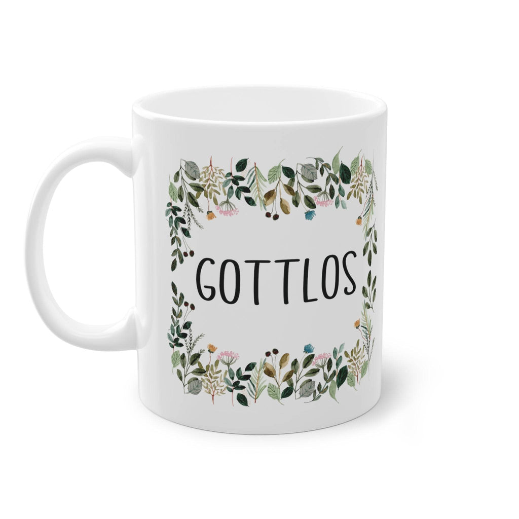 a white coffee mug with the words gottllos printed on it