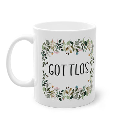 a white coffee mug with the words gottllos printed on it