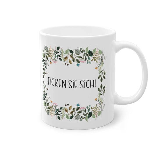 a white coffee mug with a floral border
