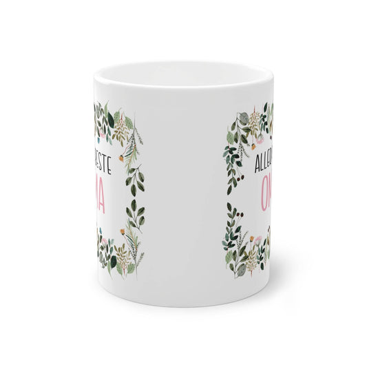 a white mug with a floral design on it