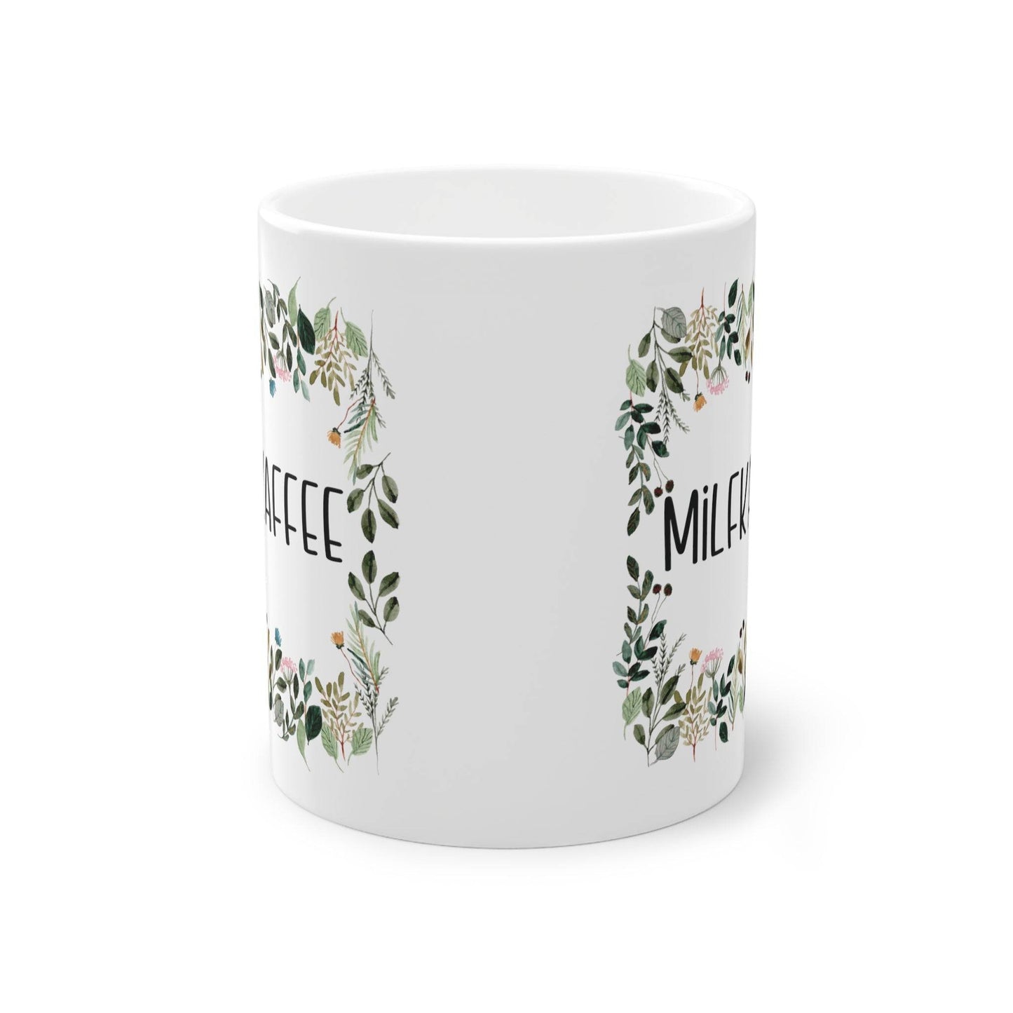 a white coffee mug with a floral design
