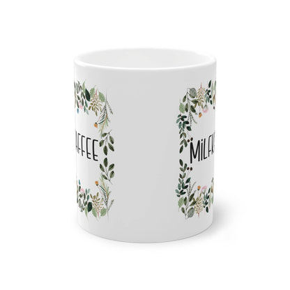 a white coffee mug with a floral design