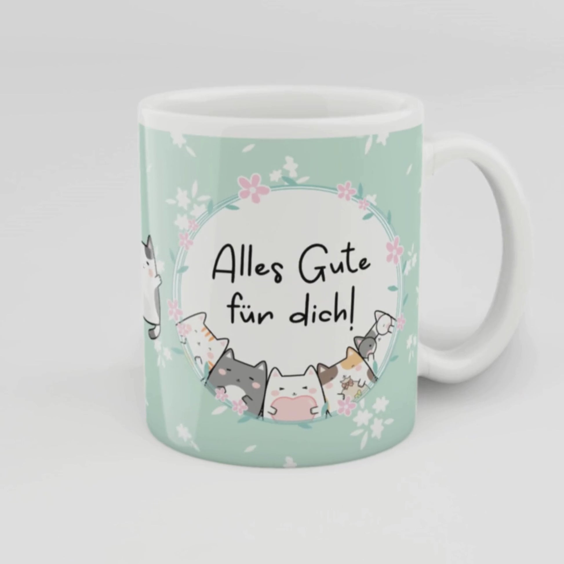 Niedliche Geschenk-Tasse in Mintgrün mit Blumendesign und Katzenillustrationen, Aufschrift „Alles Gute für dich!“ – ideal für Geburtstage, kleine Gesten und herzliche Wünsche.